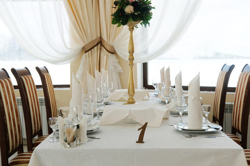 Interior of a cafe with the serviced tables