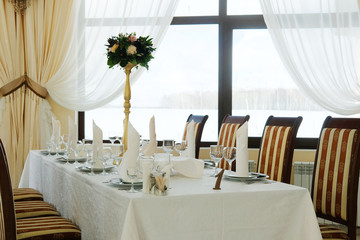 Interior of a cafe with the serviced tables