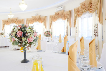 Interior of a cafe with the serviced tables