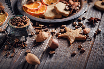 Homemade gingerbread cookies, spices and decorations
