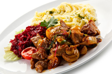 Goulash with mashed potatoes and vegetables 