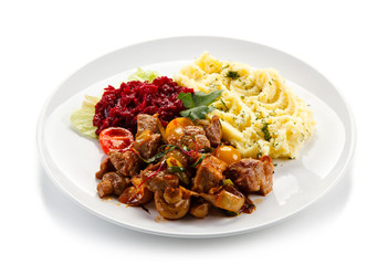 Goulash with mashed potatoes and vegetables 