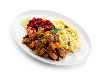 Goulash with mashed potatoes and vegetables 