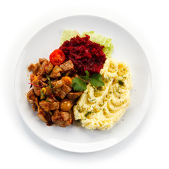 Goulash with mashed potatoes and vegetables 