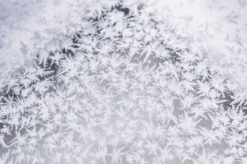 Fototapeta premium Beautiful winter background in the form of snowflakes, frost, ice crystals.