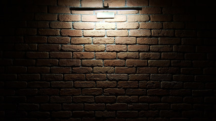 Lamp lights brick wall