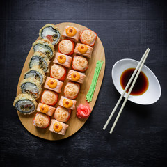 Set of traditional japanese food on dark background. Sushi. Asian food frame. Top view. Flat lay