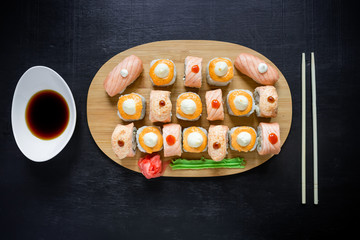 Set of traditional japanese food on a black background. Asian food frame. Top view. Flat lay