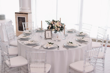 Well decorated guest numbered table in tenderless wedding hall