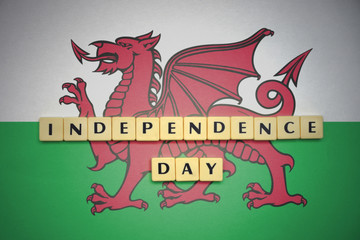 letters with text independence day on the national flag of wales.