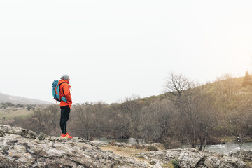 Fototapeta premium Young Backpacker enjoying of Nature.