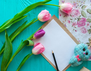 Mother's Day, woman's day.  pink tulips ,presents   and letter on wooden background