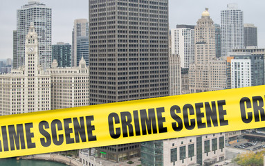 Fototapeta premium Crime scene cordon tape superimposed over Chicago skyline