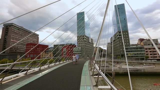 Beautiful view on peaceful buildings and Zubizuri bridge in Bilbao, Spain 