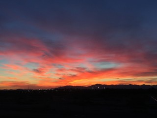 Vibrant sunset sky with dramatic orange clouds