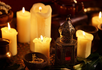 Body oil sensual lotion candles with aroma lamp. Essential oil and therapy.