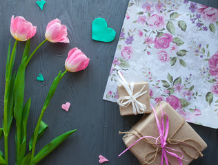 Mother's Day, woman's day. tulips ,presents and letter on wooden background