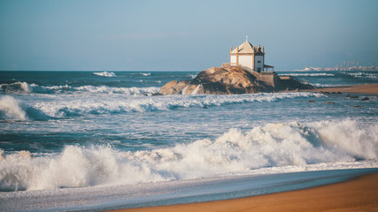 Miramar Beach and chapel Senhor da Pedra, near Porto, Portugal.