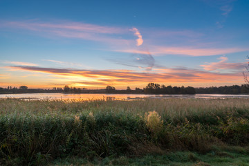 Panorama of Willen Lakeside Park in Milton Keynes at sunrise, UK