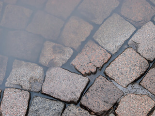 wet cobblestone pavement