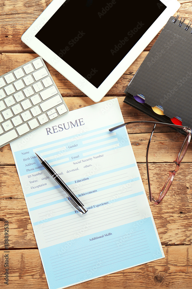 Wall mural Blank resume form on wooden table