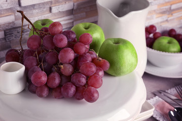 Composition with fresh fruits on white stand, close up