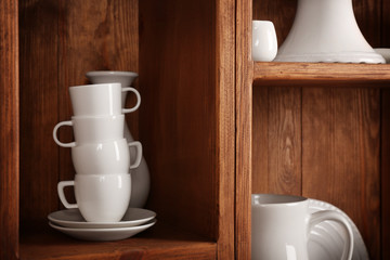 Wooden shelves with white rustic dinnerware