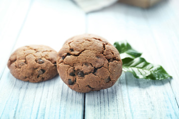 Delicious coffee cookies on wooden table, closeup
