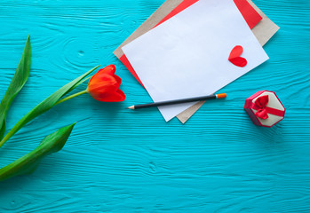Mother's Day, woman's day.red  tulips ,presents and letter  on wooden background