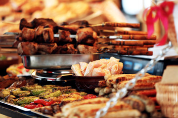 Trays with different kinds of food on counter