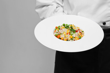 Chef hands with garnish closeup