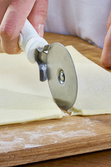 Making Croissant Cookies with Jam. Series. Cutting dough with cutter