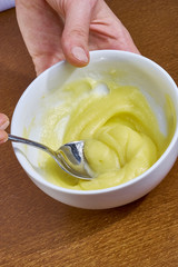 chef whips yellow cream in a bowl by hand for making cheesecakes complete series of food recipes