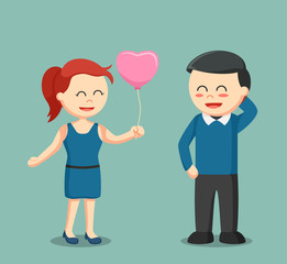girl giving man love balloon