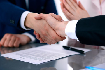 Business people shaking hands finishing up a meeting