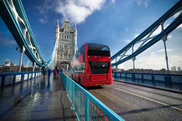Fotobehang Red bus crossing London Tower Bridge at mid day in London, England  © Pawel Pajor