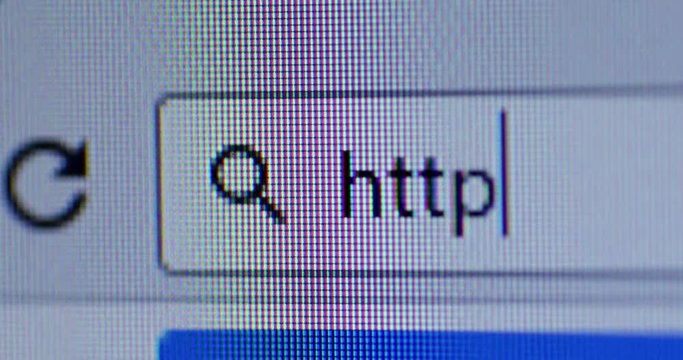 Video footage of a cursor typing http on the browser bar. Internet Search Concept