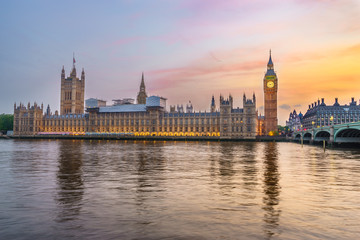 Fototapeta na wymiar Houses of Parliament from across the River Thames at dusk. Part of Westminster Bridge can be seen