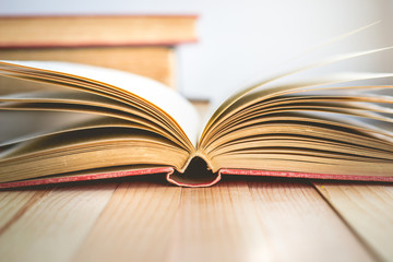 Close Up Open book and stack of books with copy space in relaxation and cozy mood, Image for education and brightness  concept