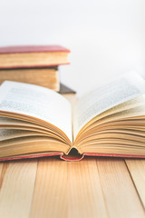 Open book and stack of books with copy space in relaxation and cozy mood, Image for education and brightness  concept