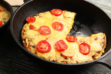 Freshly baked pizza in a pan