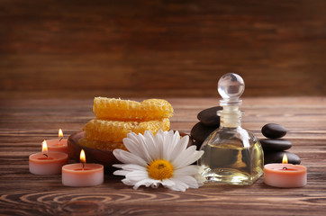 Spa concept. Natural treatments and candles on wooden background