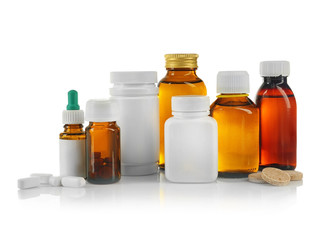 Bottles with cough syrup, pills and medicines isolated on white