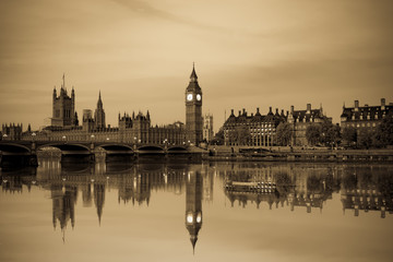 Fototapeta na wymiar Vintage picture of London Big Ben and House of Parliament viewed at sunrise in London. England