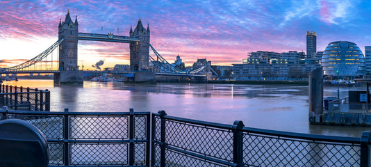 Panorama of London Tower Bridge and Thames River viewed at sunrise in London, England