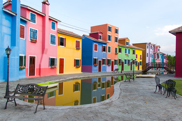 colorful townhouse and pond