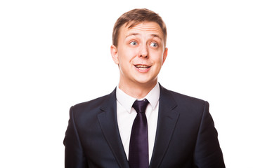 Young handsome businessman in black suit is standing straight, portrait isolated on white background