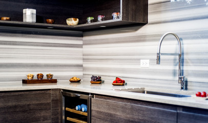 Countertops inside modern kitchen, interior design of brown wooden cabinets and granite kitchen...