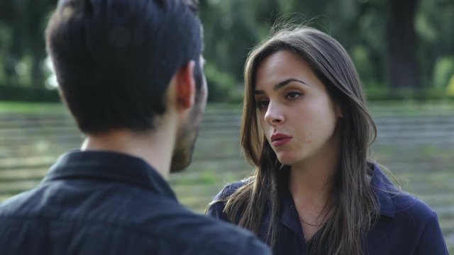 cute girl at the park is leaving the boyfriend