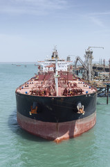 Tanker berthed in port.